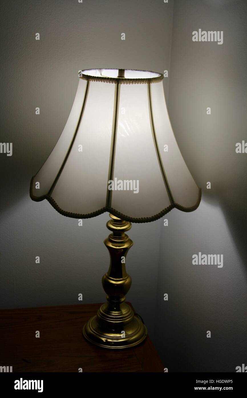 A lamp that is turned on in the living room. Stock Photo