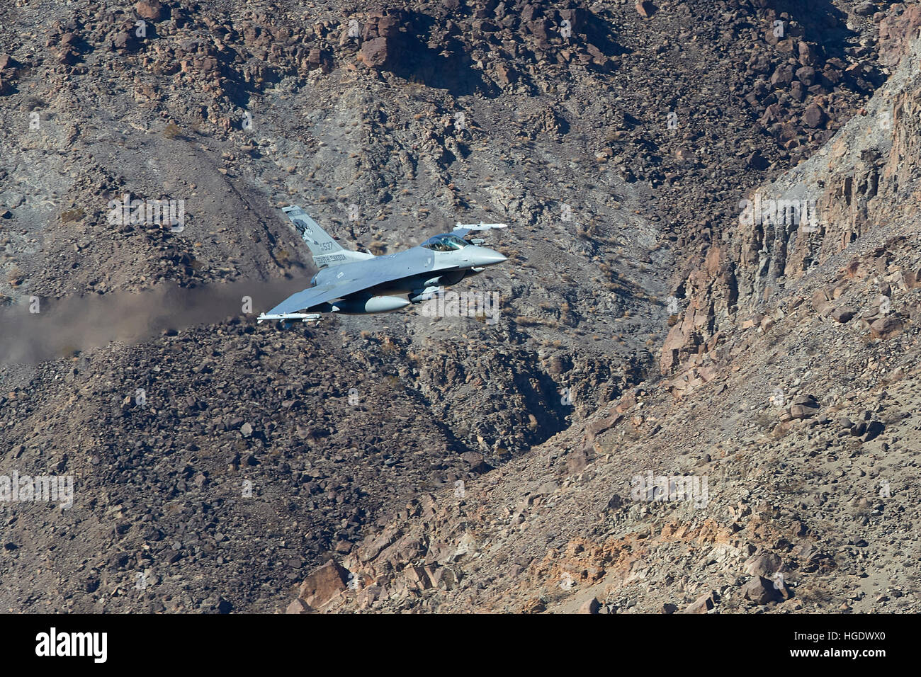 US Air Force F-16C, Flying Through Rainbow Canyon, California, 8 November 2016 Stock Photo