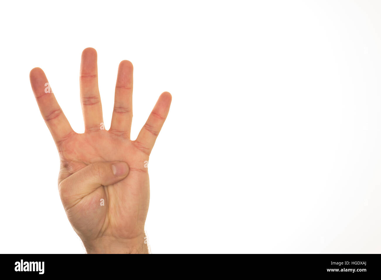 Hand showing four fingers for counting and indicating numbers. Stock Photo