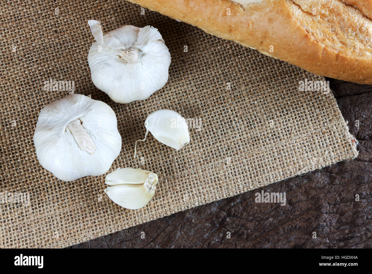 Garlic cloves on a vintage wooden background Stock Photo - Alamy