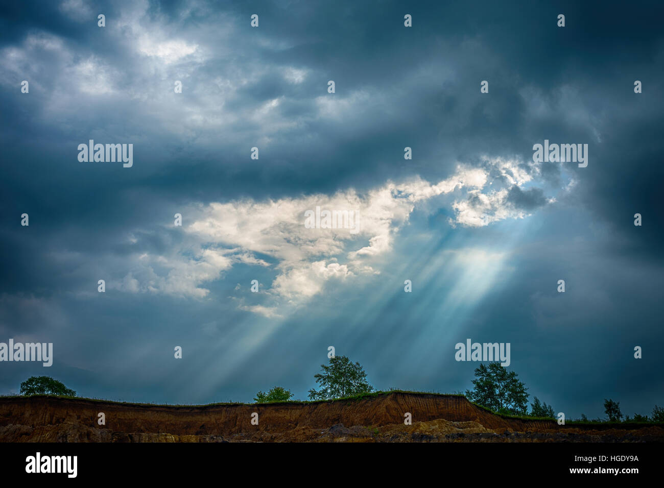 Worksite and trees with cloudy sky in Novokuznetsk, Russia Stock Photo