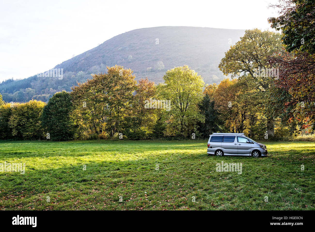 Lone campervan in a field in Monmouthshire below the Brecon Beacons Black Mountains Stock Photo
