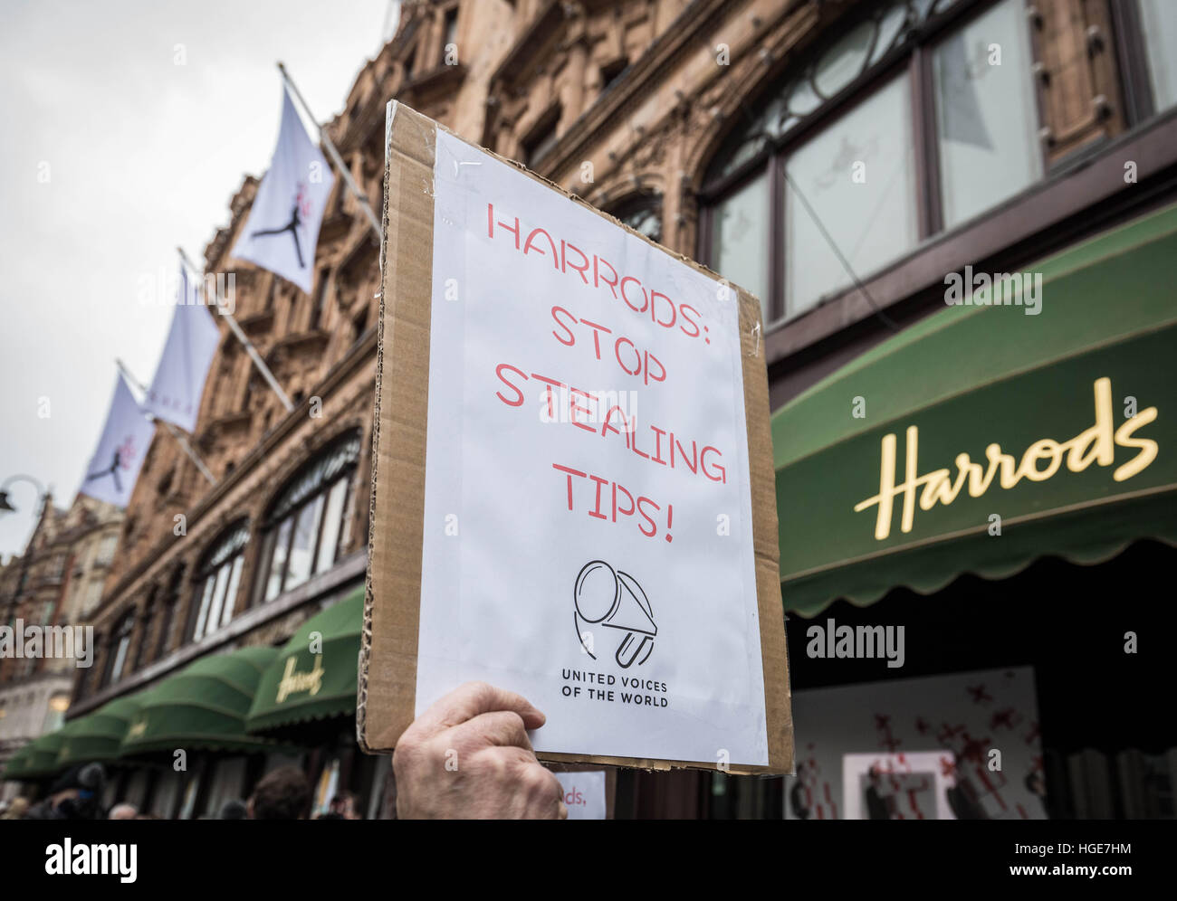 London, UK. 7th January, 2017. United Voices of the World which represents chefs and waiters working at Harrods protested outside Harrods in Knightsbridge as waiters and kitchen workers call for more openness about tips. Demonstrators are accusing Harrods of shortchanging its restaurant staff in a row over how service charges added to diners' bills are shared among workers © Guy Corbishley/Alamy Live News Stock Photo