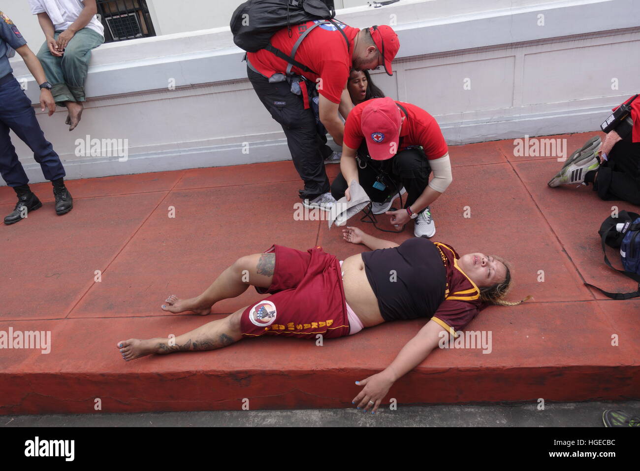 Manila, Philippines - January 9. 2017: A unconscious Catholic devotee getting firsd aid during the Feast of the Black Nazarene. © Roland Nagy/Alamy Live News Stock Photo