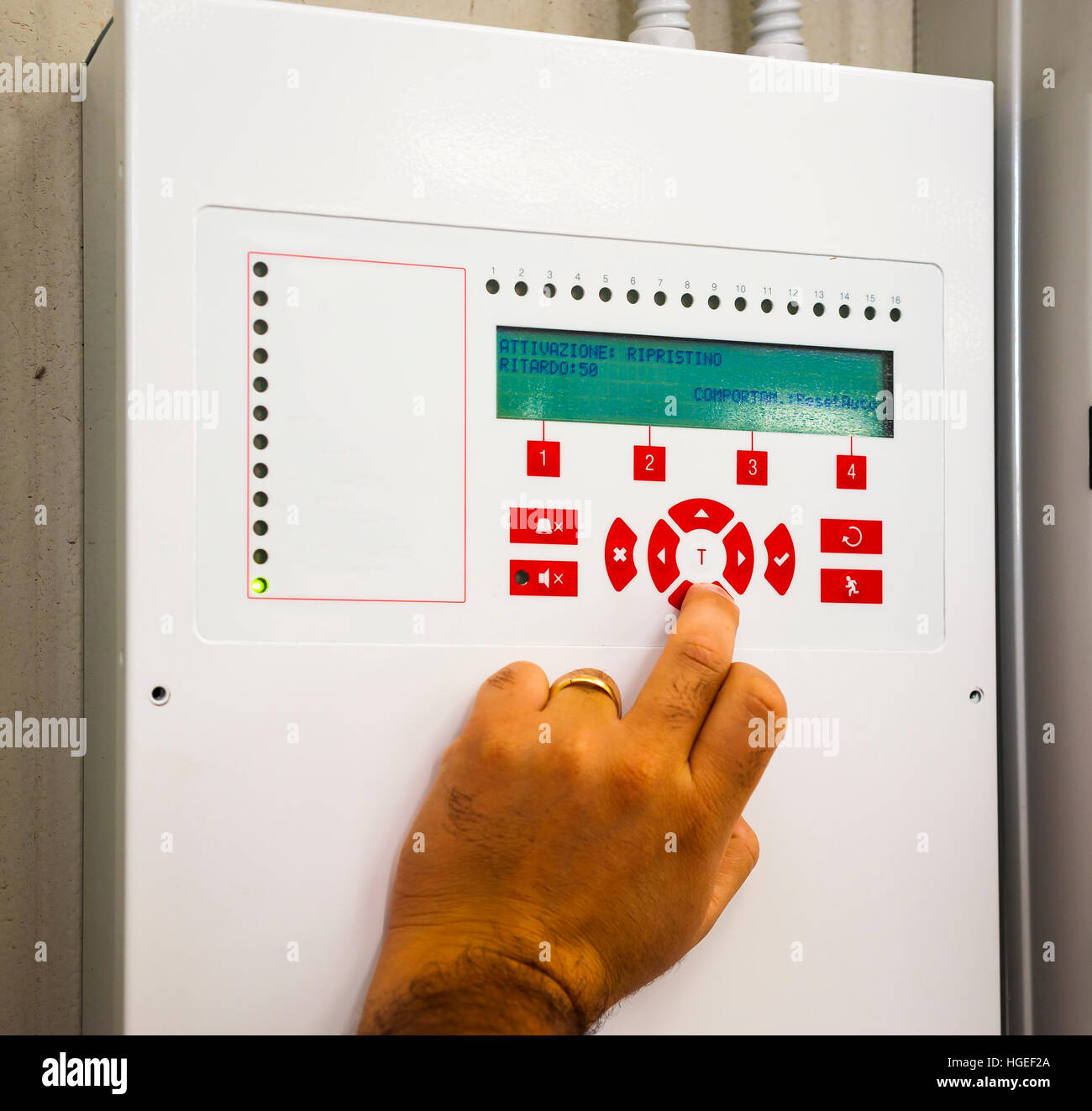A technician works box panel system fire or smoke alarm Stock Photo