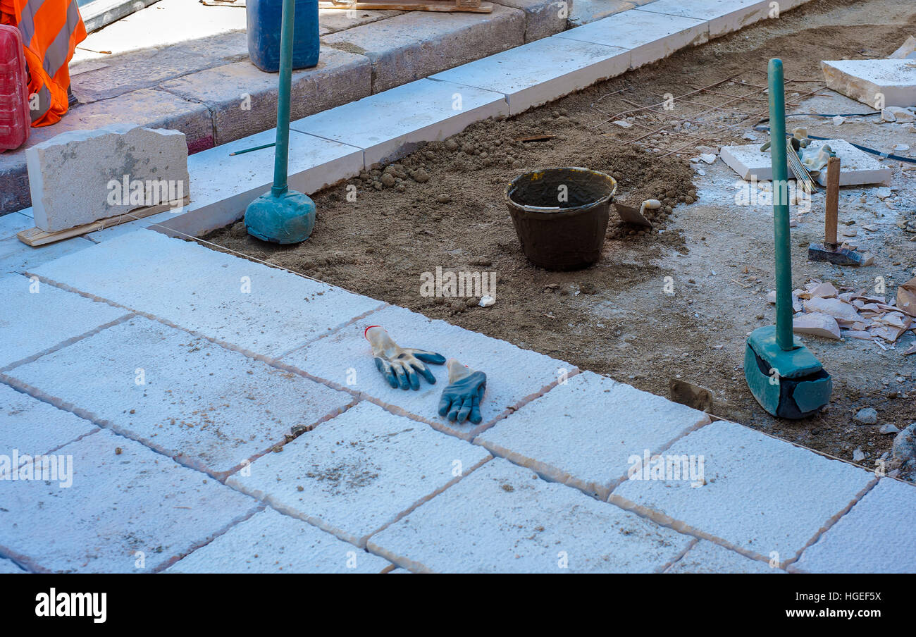 site area for the urban street pavement with limestone slabs. To avoid slipping the stones were roughened with a hammer to 'bocciardal' Stock Photo