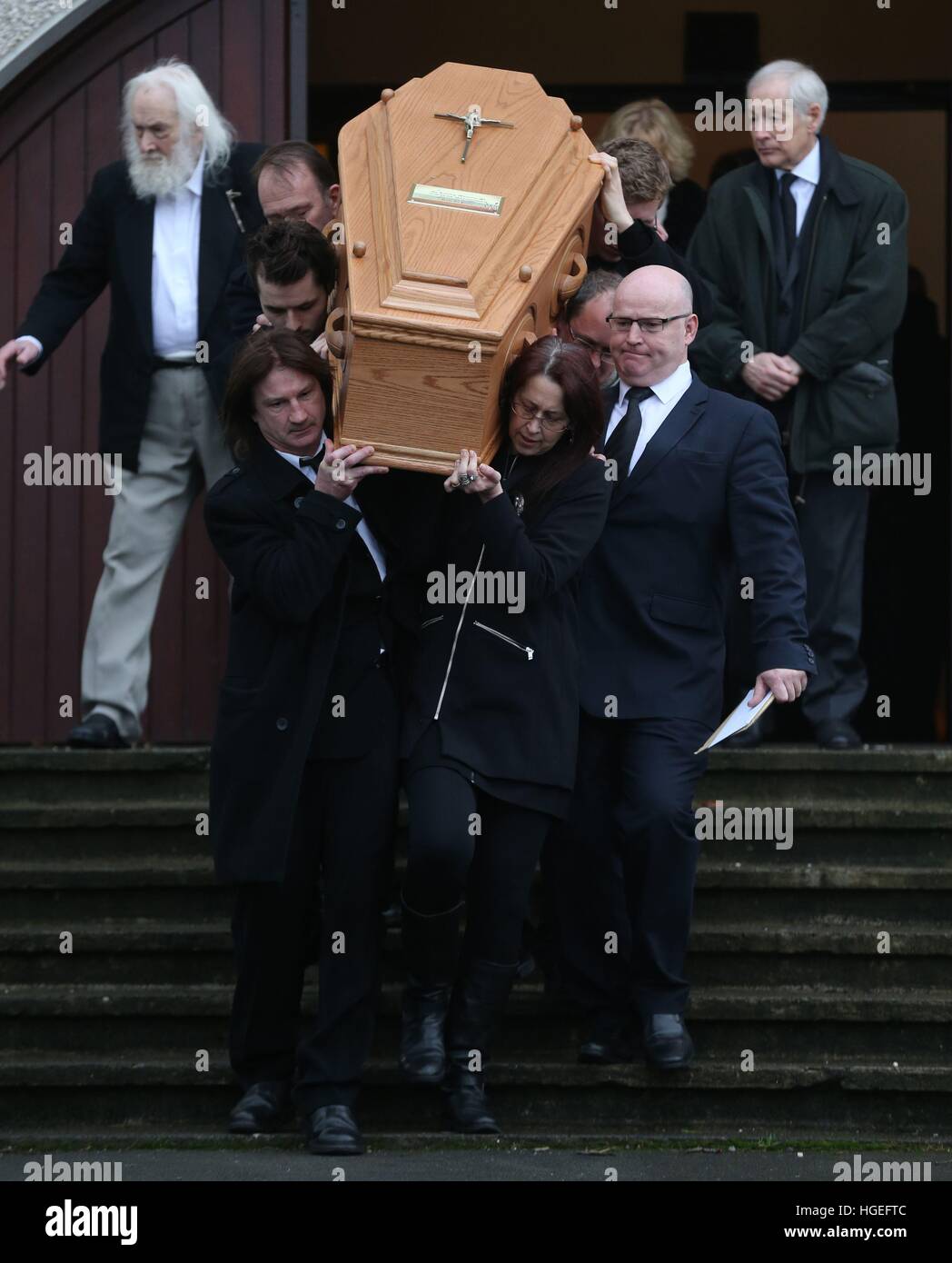 Family members carry the coffin at the funeral of Therese MacGowan, 87, the mother of singer Shane MacGowan, at Our Lady of Lourdes Church, Silvermines Co Tipperary. Stock Photo