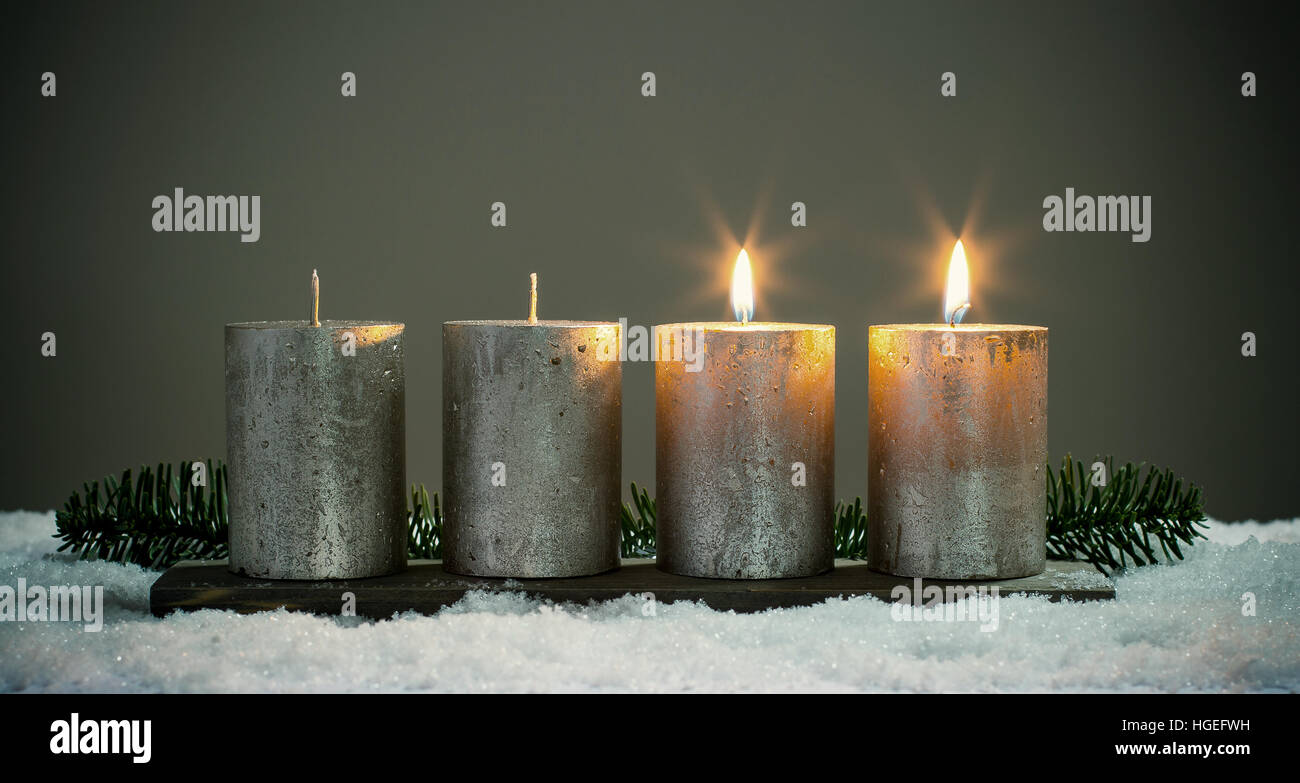 Light four advents candles with matches Stock Photo Alamy