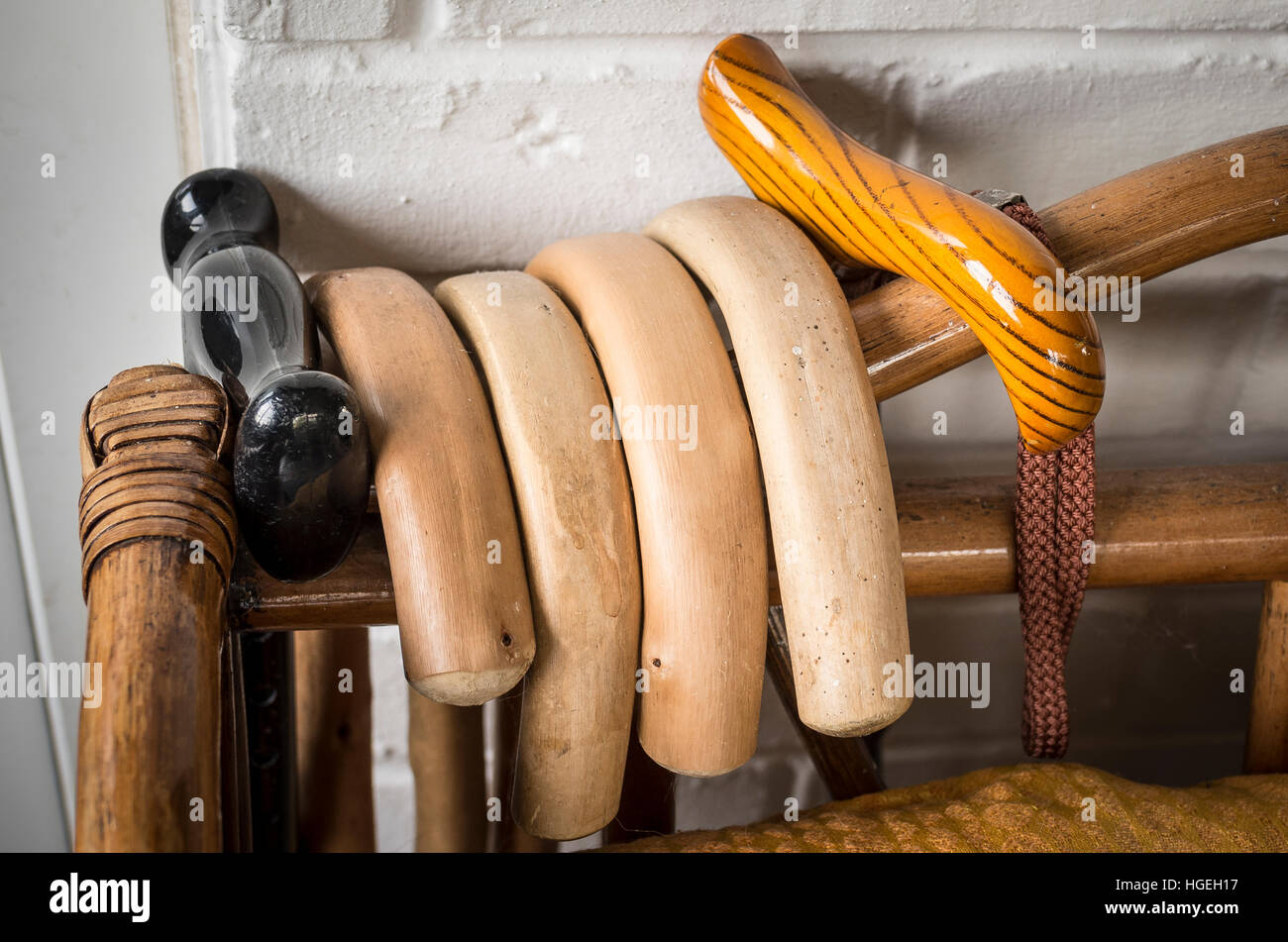 Collection of in-use walking sticks stored in an accessible place Stock Photo