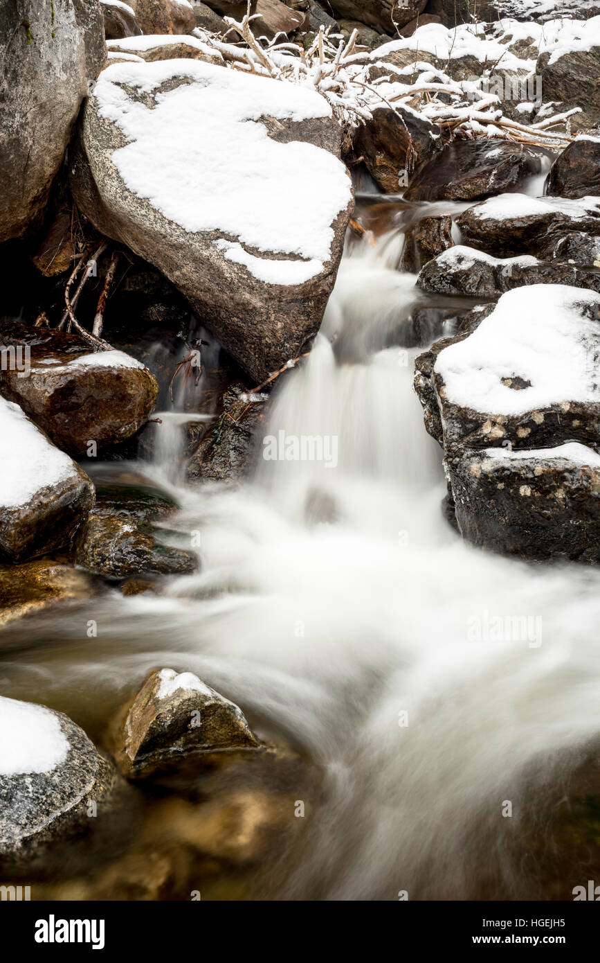 Small waterfall in winter with rocks and snow Stock Photo - Alamy