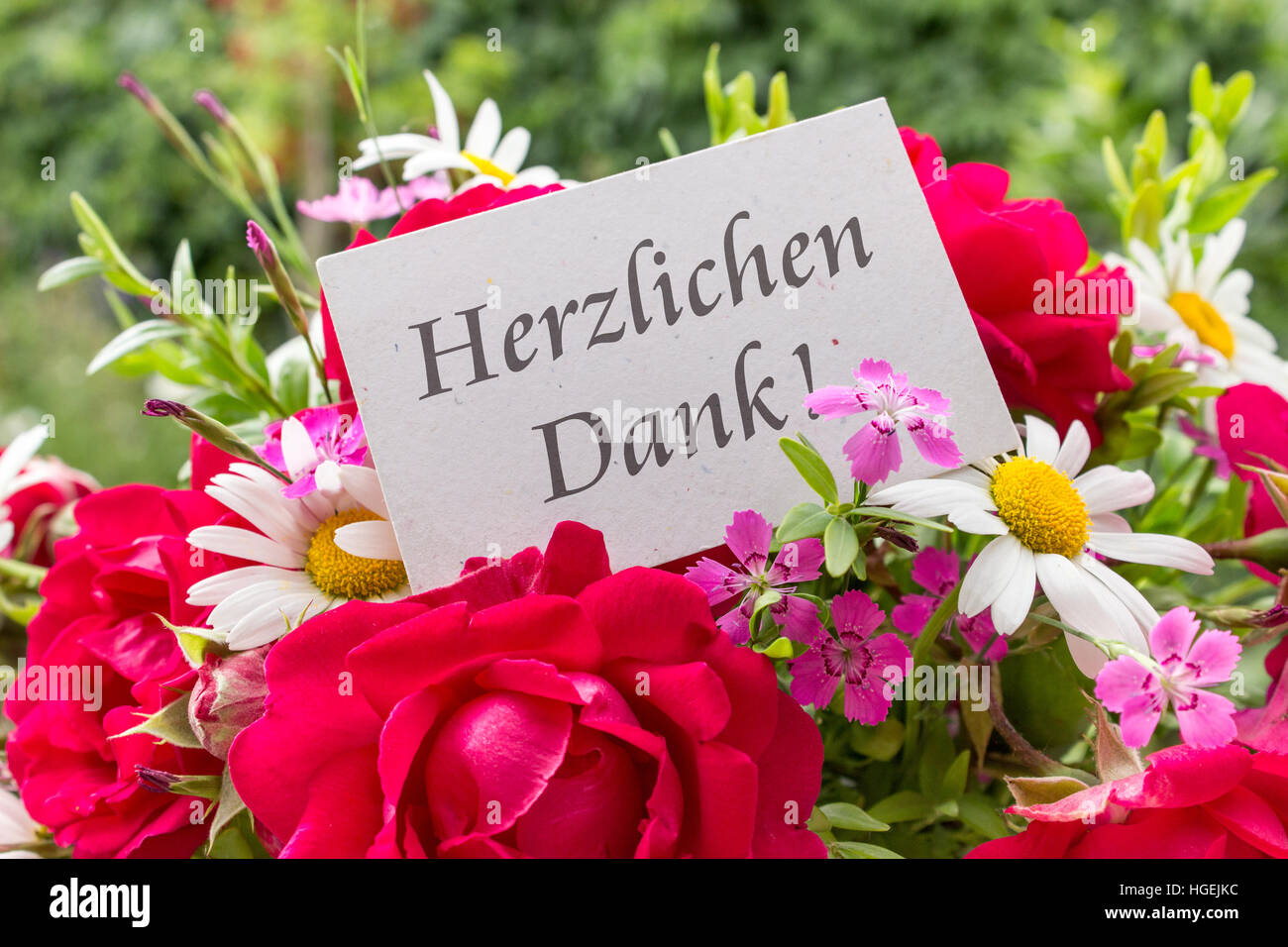 Summer flowers and card with German text: Thank you Stock Photo