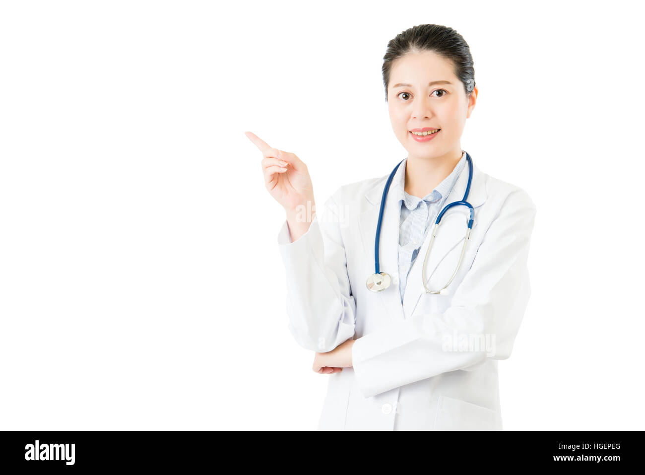 Doctor Point Woman Happy beautiful female doctor point gesture blank area or copyspace ...