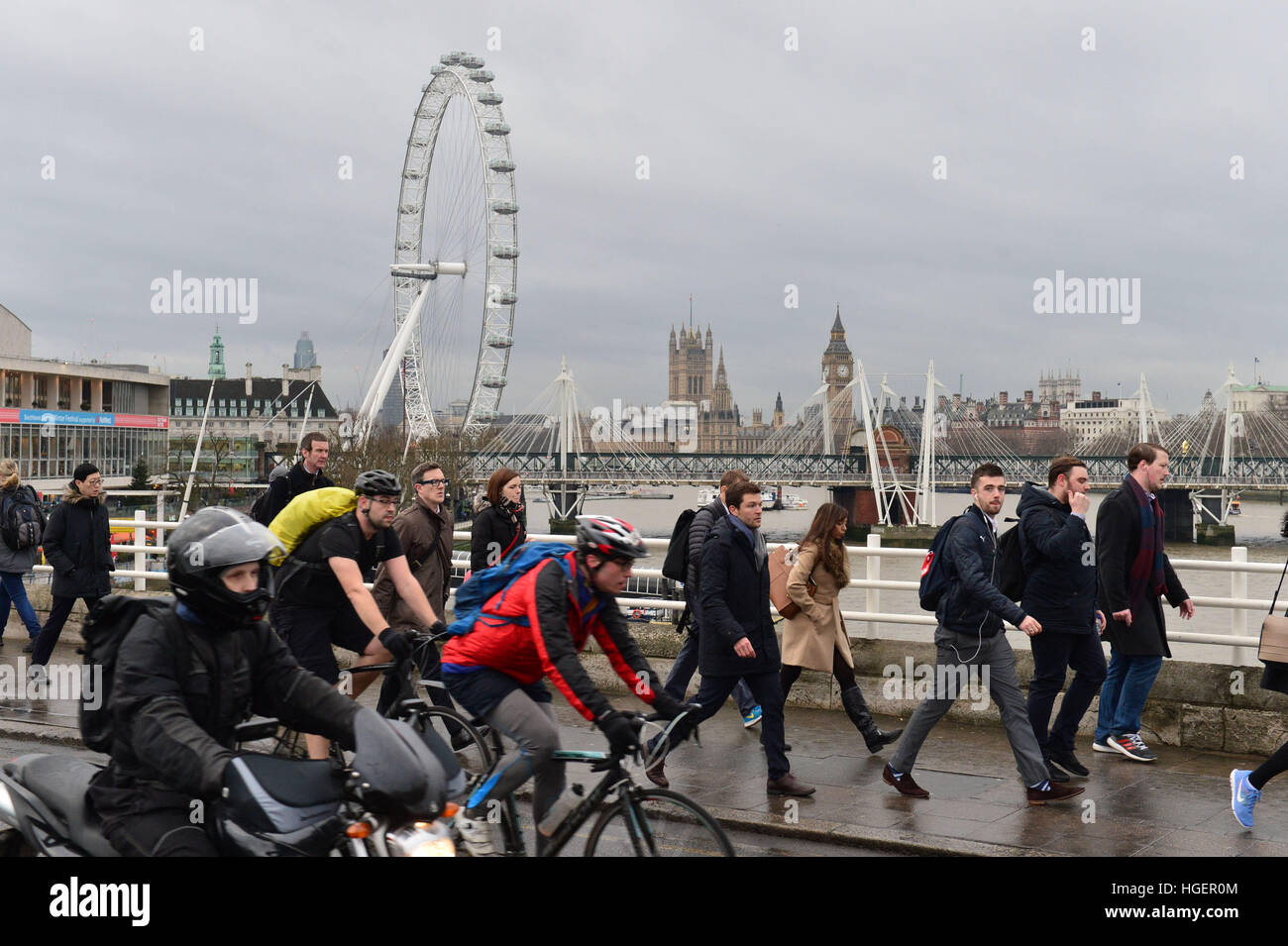 Commuters cross Waterloo Bridge in London, as London Underground workers launched a 24-hour strike which will cripple Tube services and cause travel chaos for millions of passengers. Stock Photo