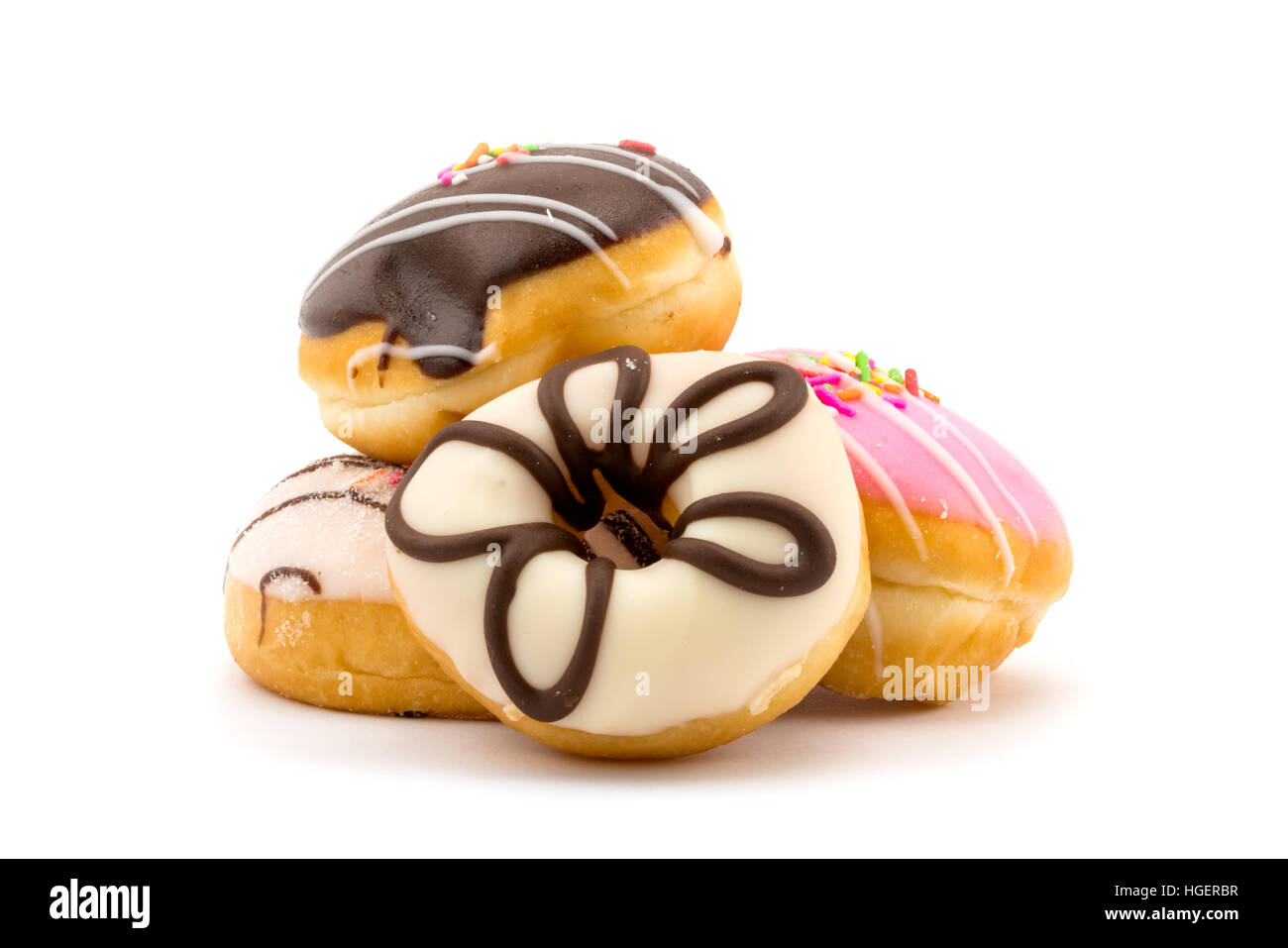 Pile of colorful doughnuts on white background Stock Photo