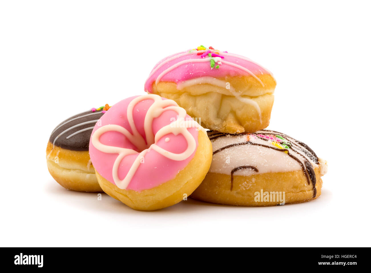 Pile of colorful tasty doughnuts on white background Stock Photo
