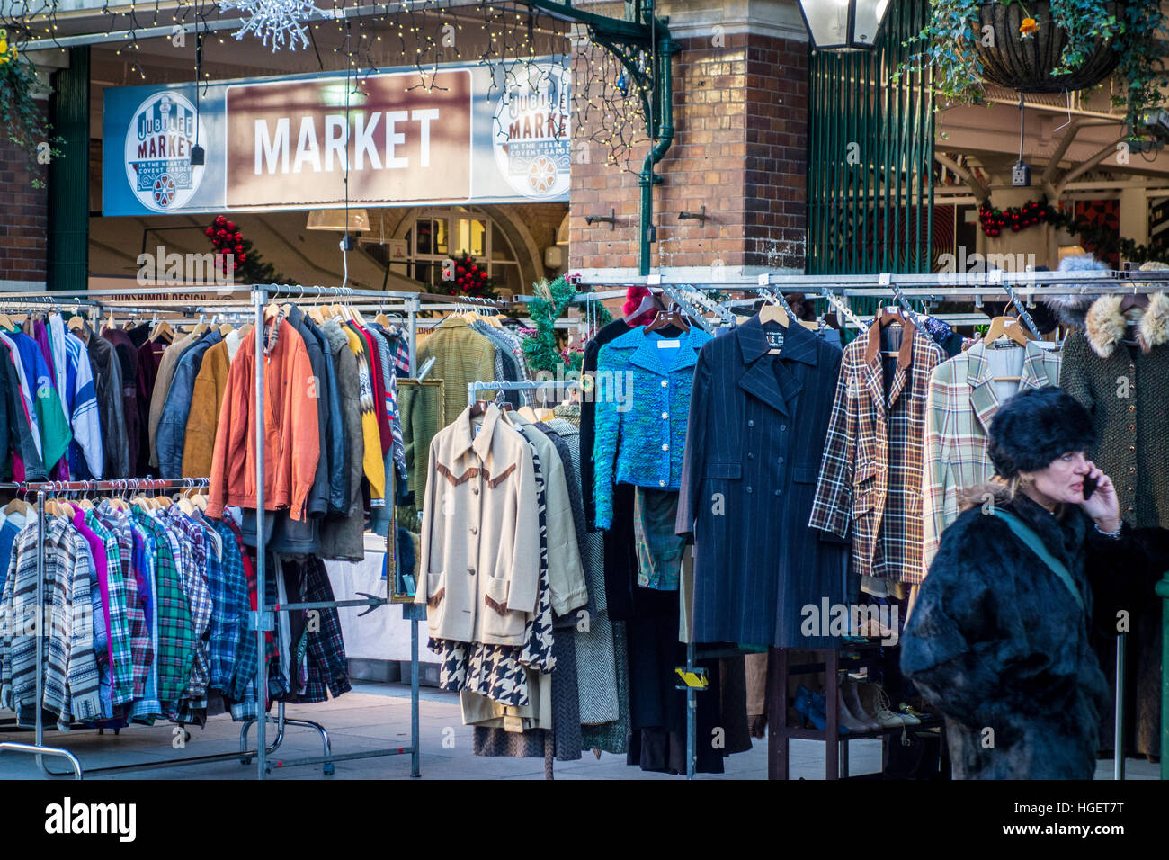 Clothes on hangers outside Jubilee Market, Covent Garden, London, UK Stock Photo