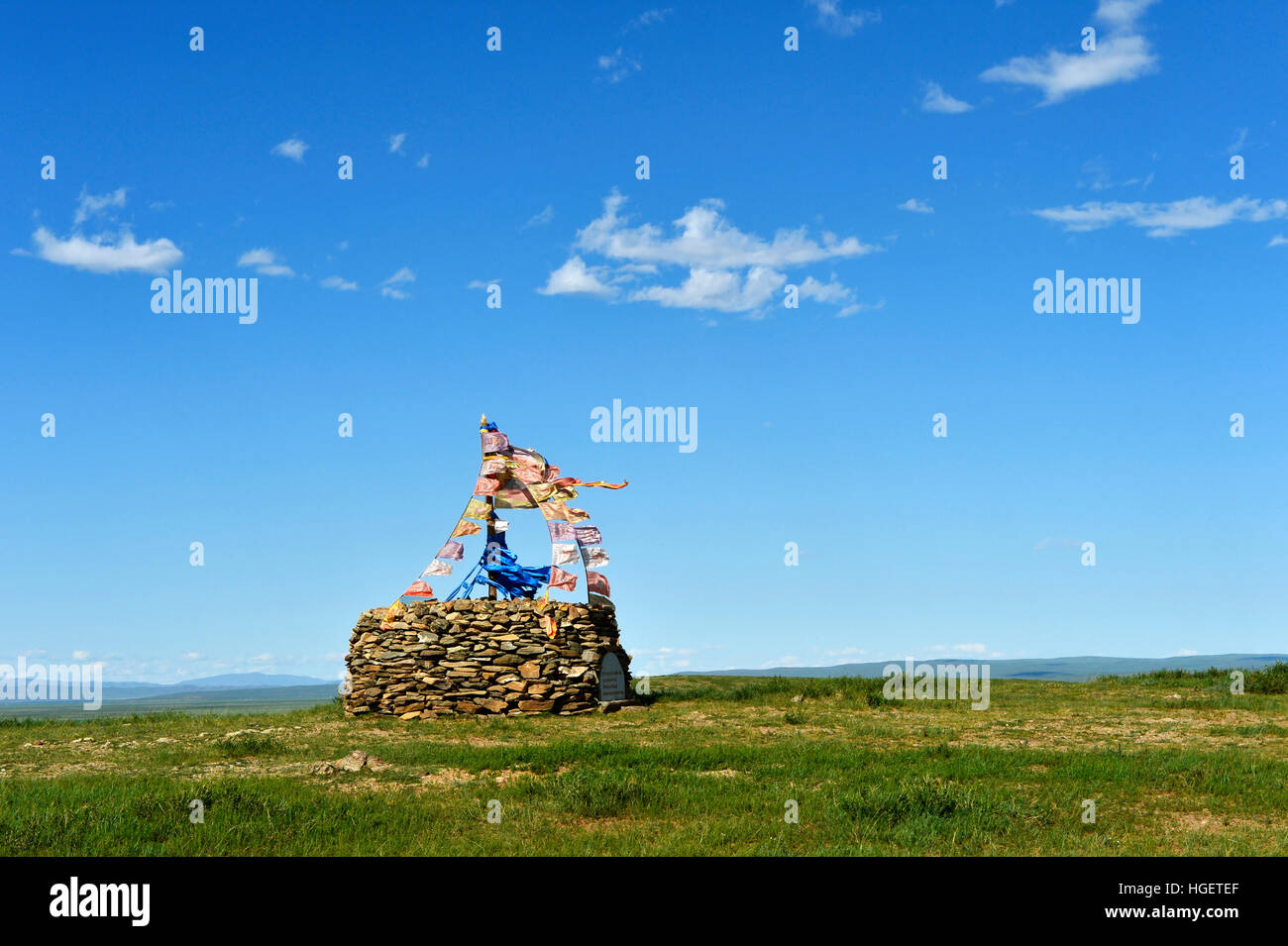 Ovoo, sacred stone heap used place of worship in Mongolian religious tradition, mountain plain in Arkhangai Aimag, Mongolia Stock Photo
