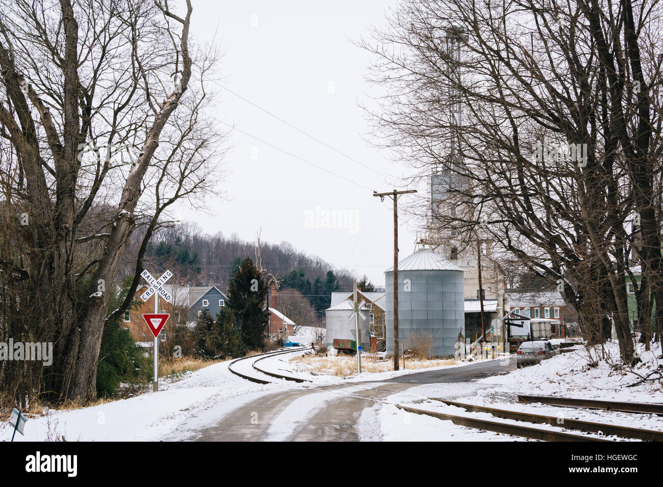 Snow covered railroad tracks and street, in Lineboro, Maryland. Stock Photo
