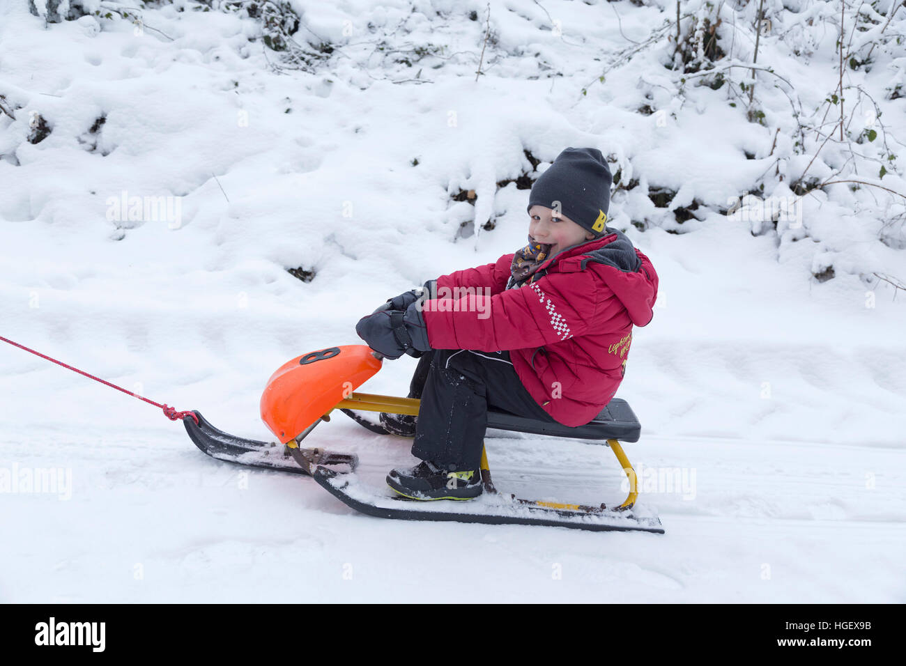 Boy pulling sledge hires stock photography and images Alamy