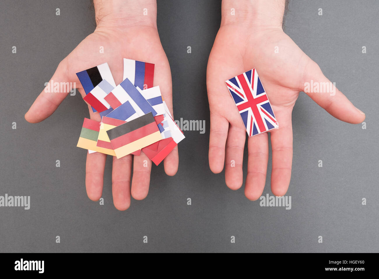 European flags and great britain flag on hands Stock Photo
