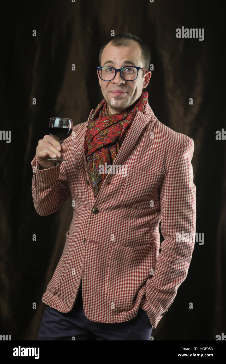The man in glasses tasting red wine, emotions. Stock Photo