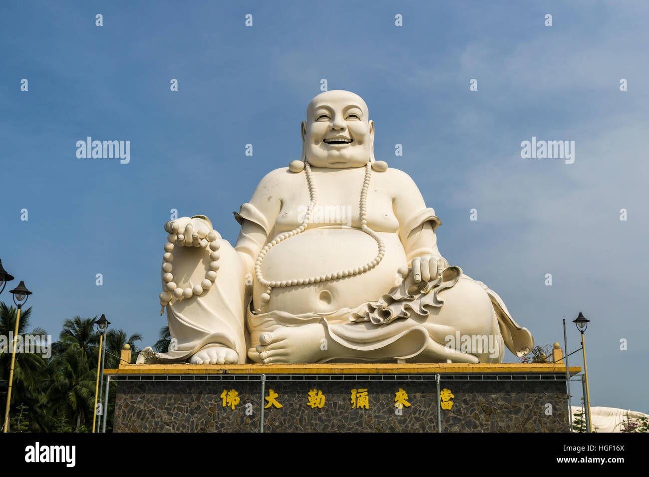 Laughing Buddha Ho Chi Minh Stock Photo - Alamy