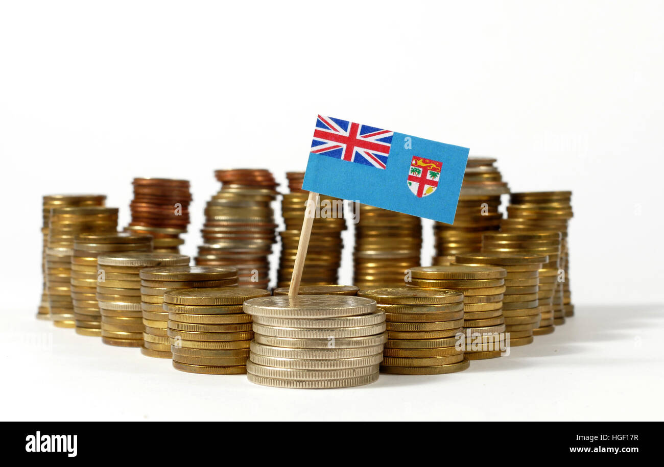 Fiji flag waving with stack of money coins Stock Photo