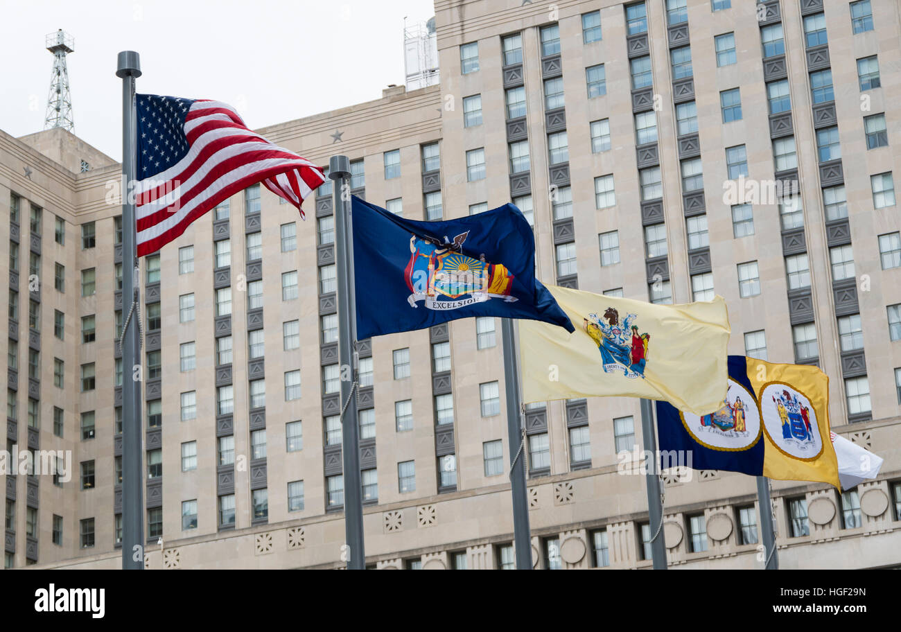 American flag, New York state flag, New Jersey state flag, and NY NJ Port Authority flag flying outside the Oculus, New York Stock Photo