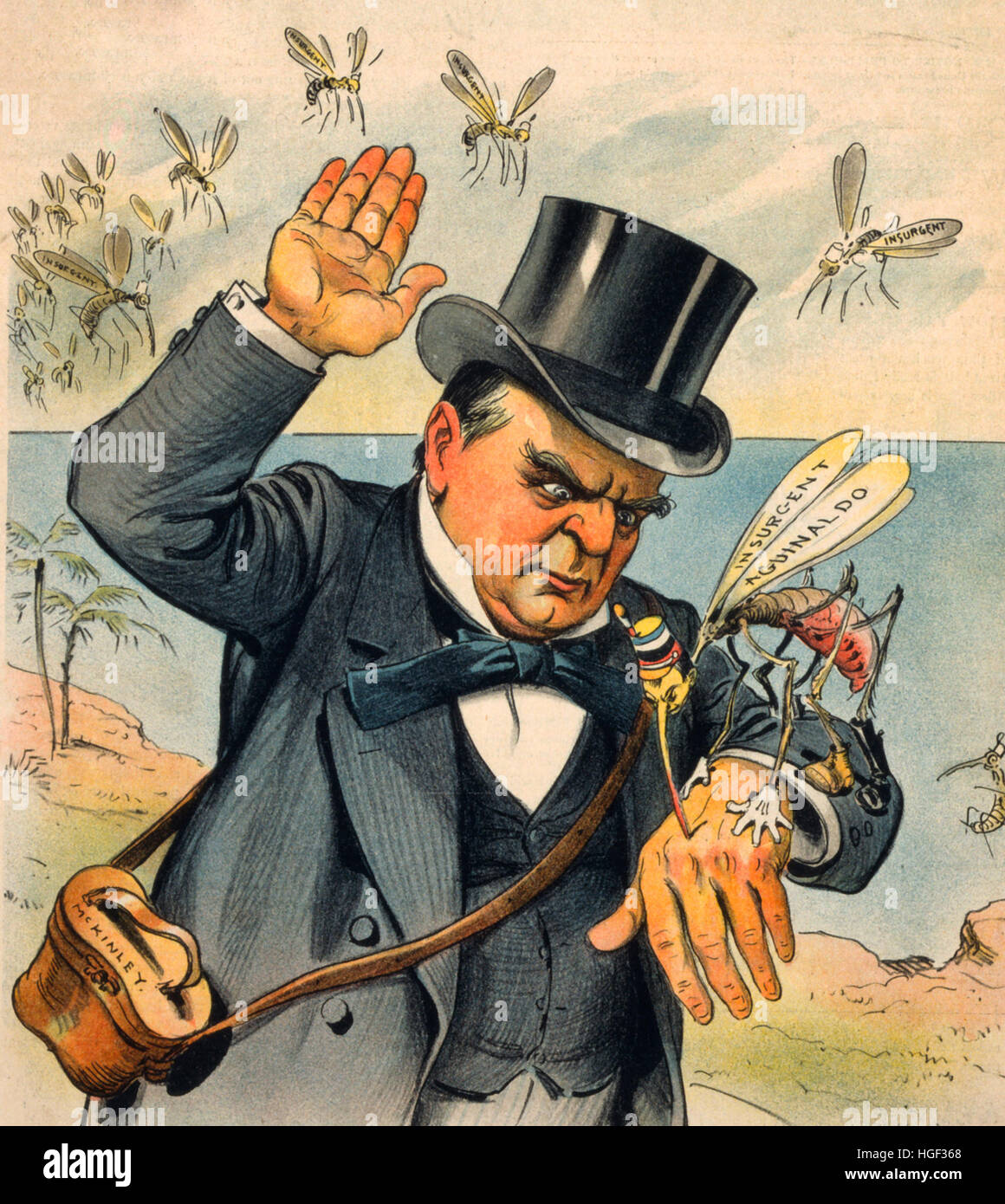 Hit him hard! President McKinley - 'Mosquitoes seem to be worse here in the Philippines than they were in Cuba'  William McKinley about to swat 'insurgent Aguinaldo,' a mosquito, as other 'insurgent' mosquitoes prepare to attack him. 1899 Stock Photo
