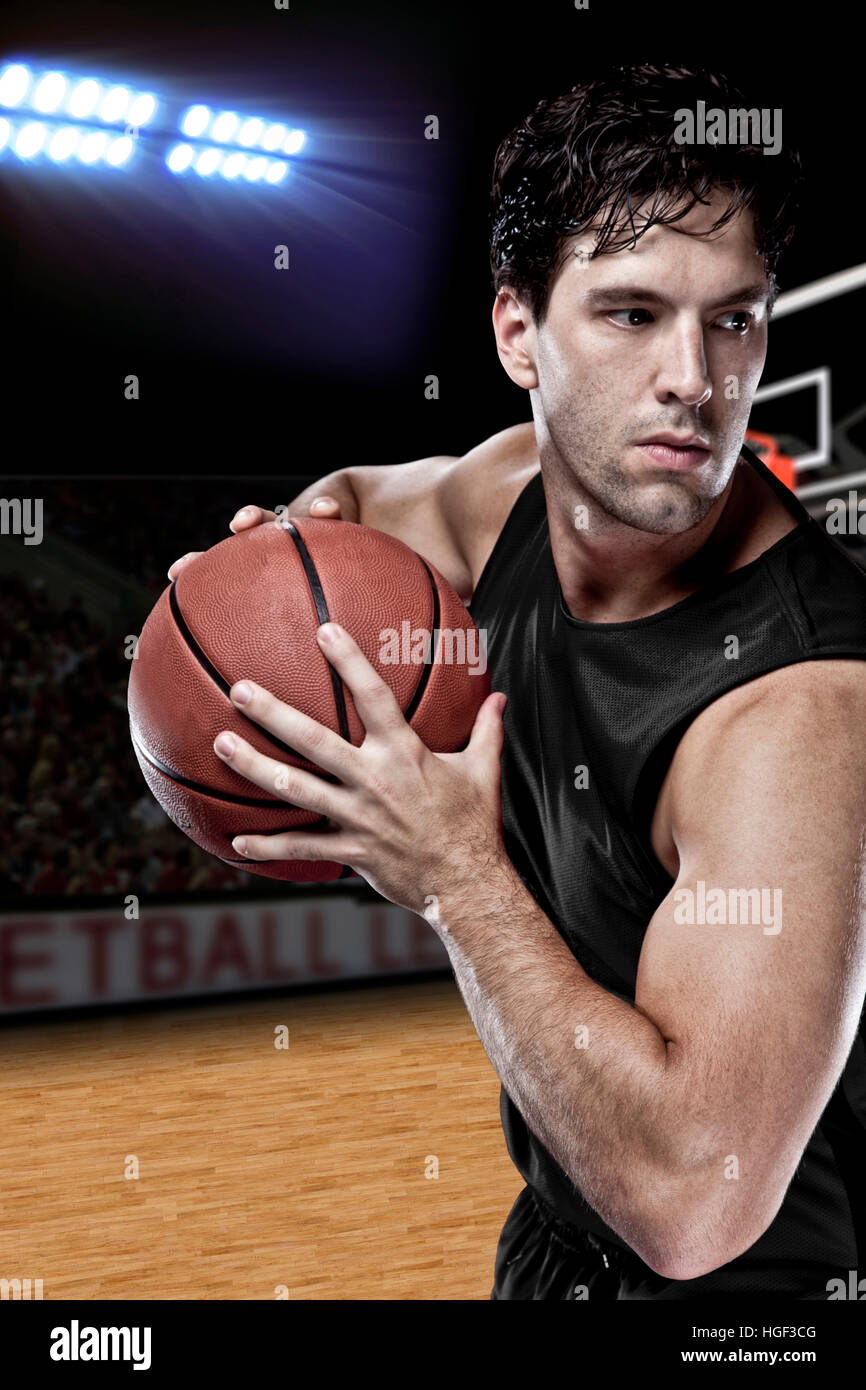 Basketball player with a Black uniform on a court Stock Photo Alamy