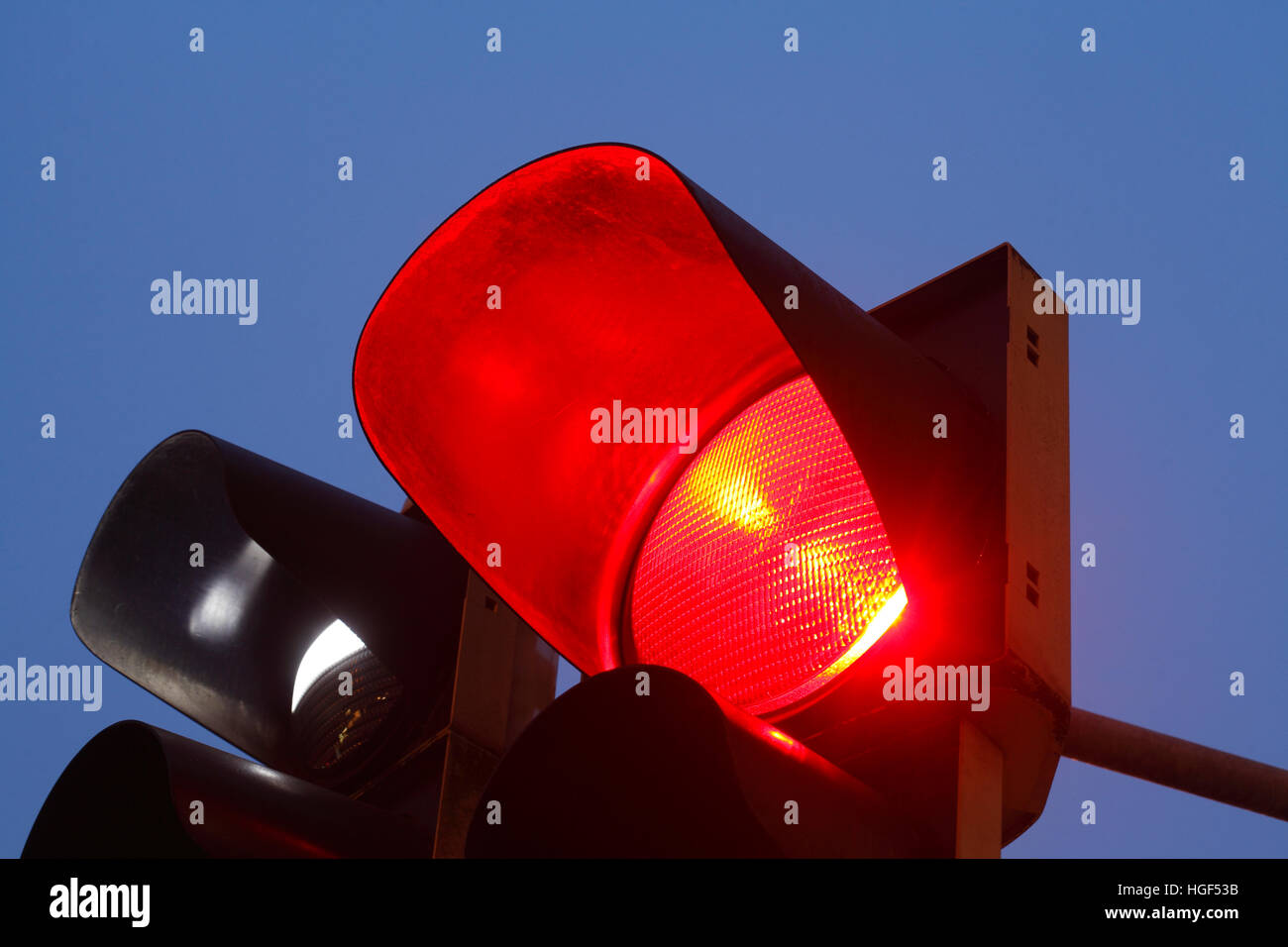 Red traffic lights at dusk, Germany Stock Photo