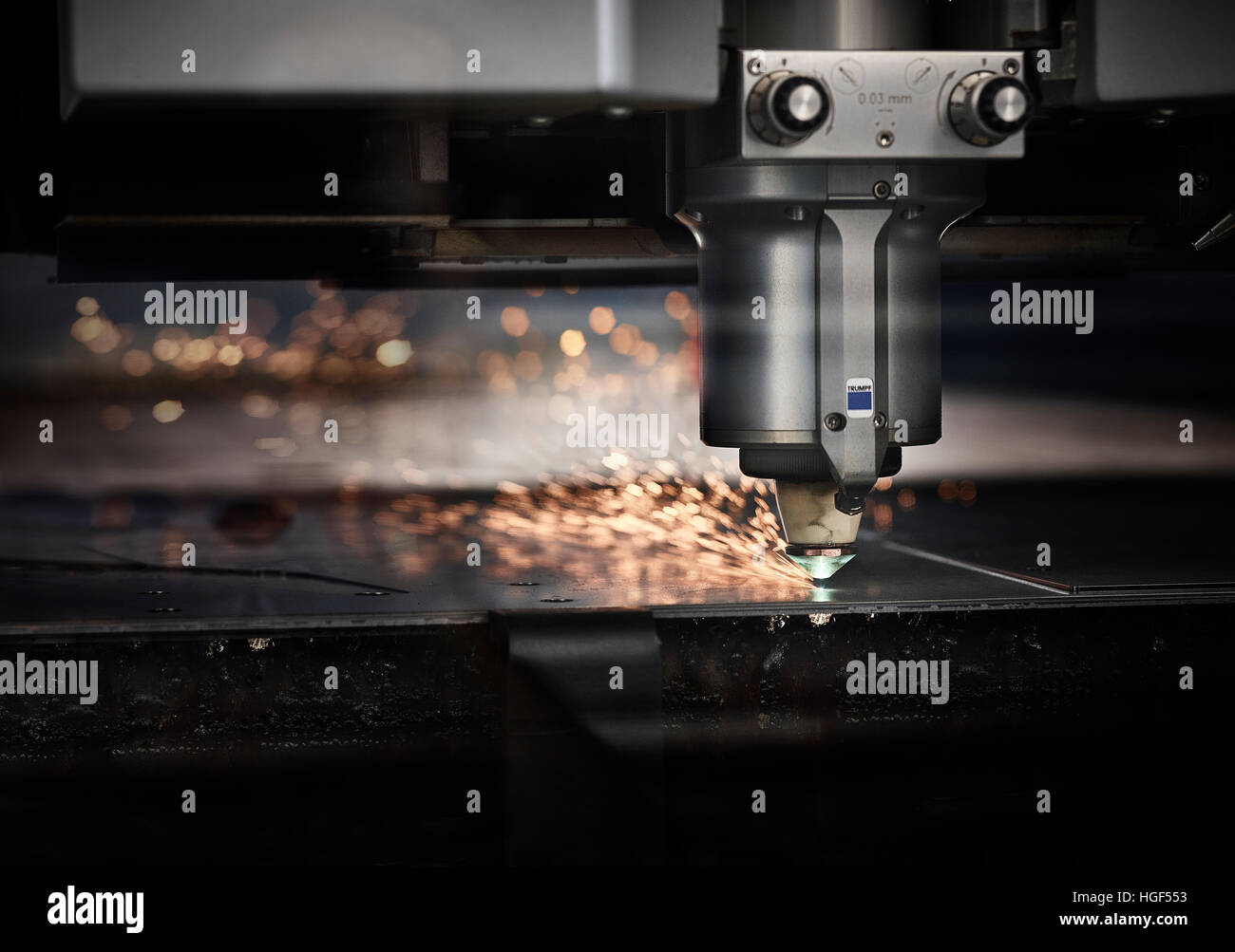 Laser cutter machine with sparks Stock Photo