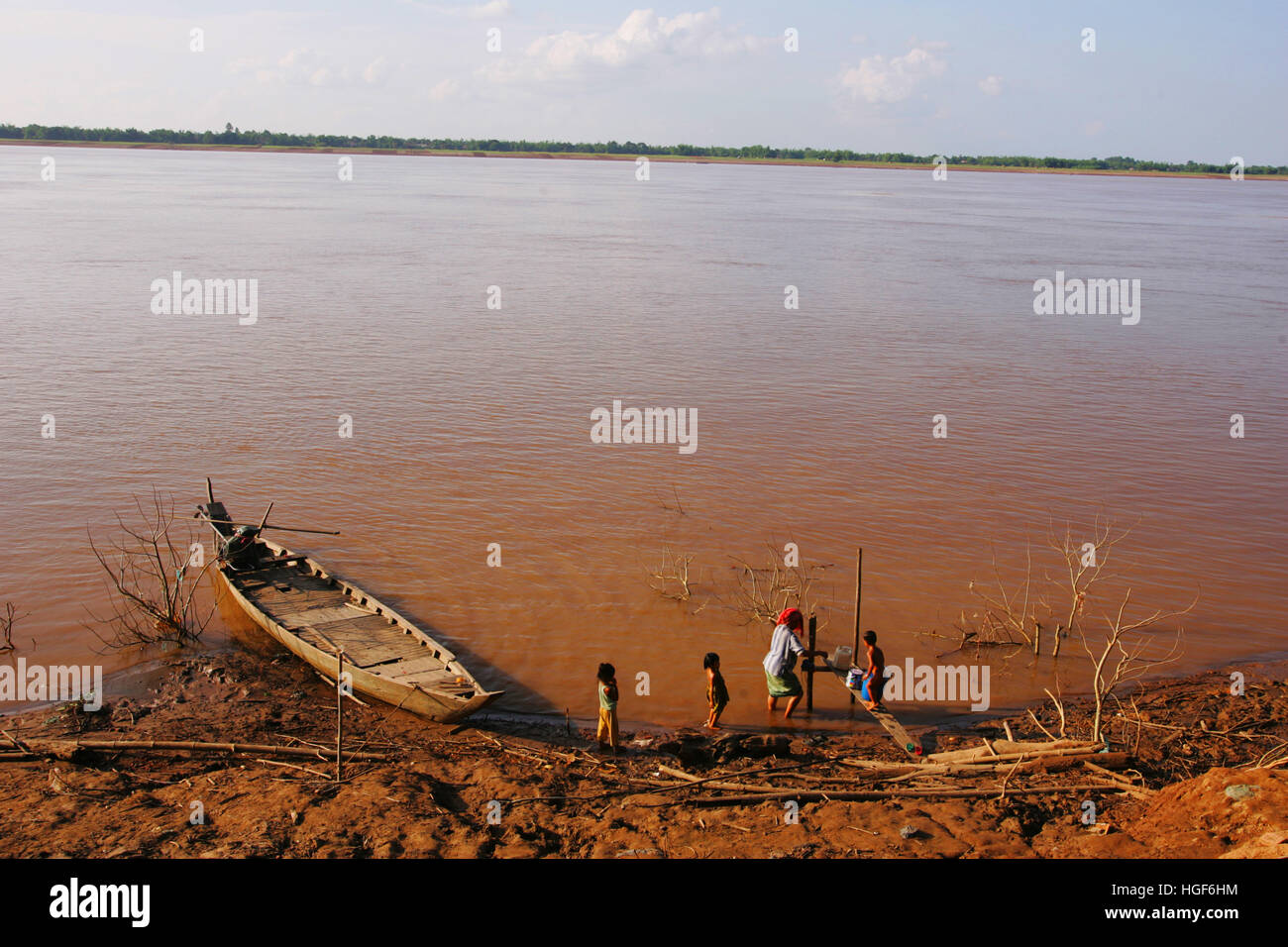 The Mekong River flows through the Moslem village of Loveathon Cambodia ...