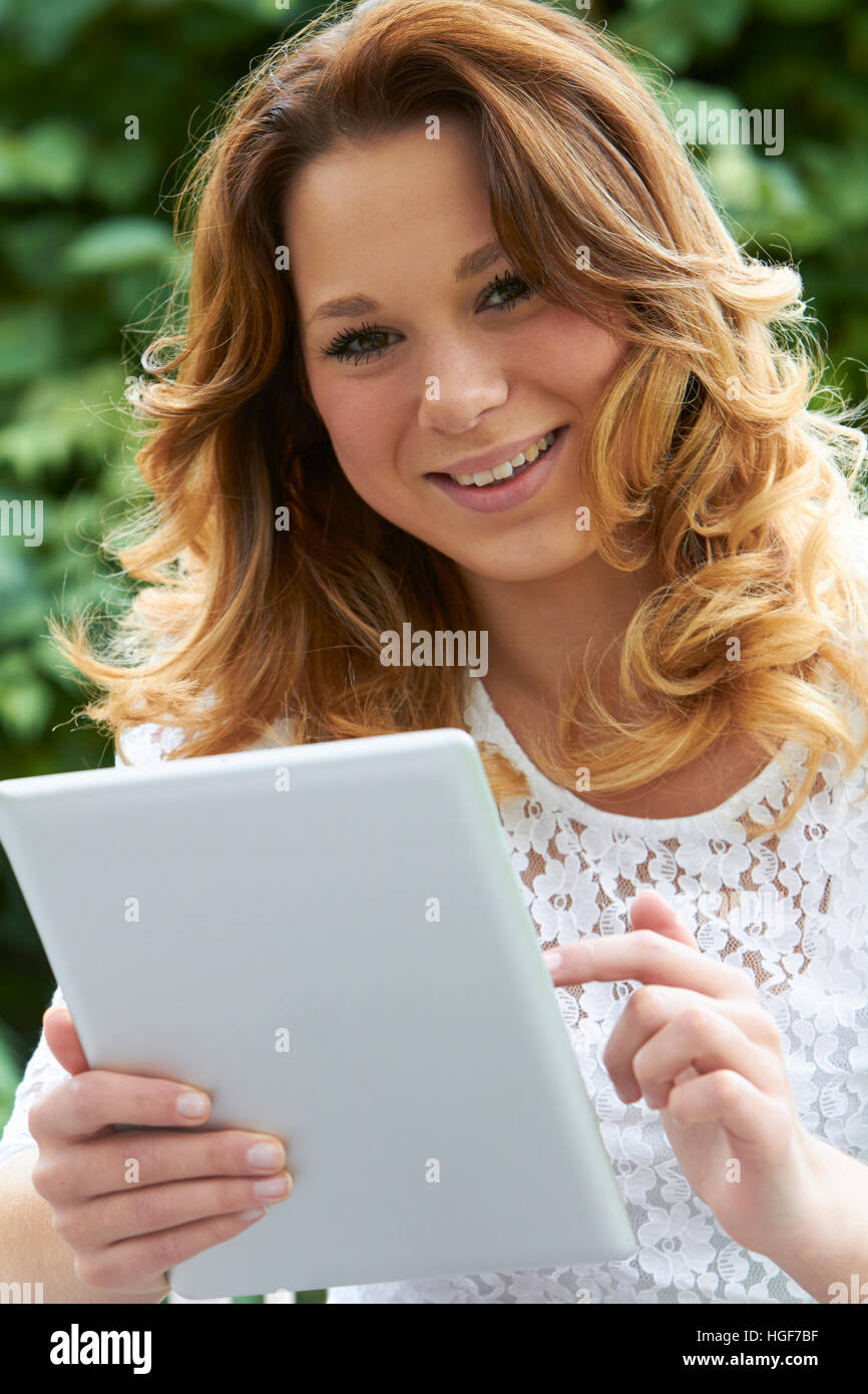 Teenage girl using tablet outdoors hi-res stock photography and images ...