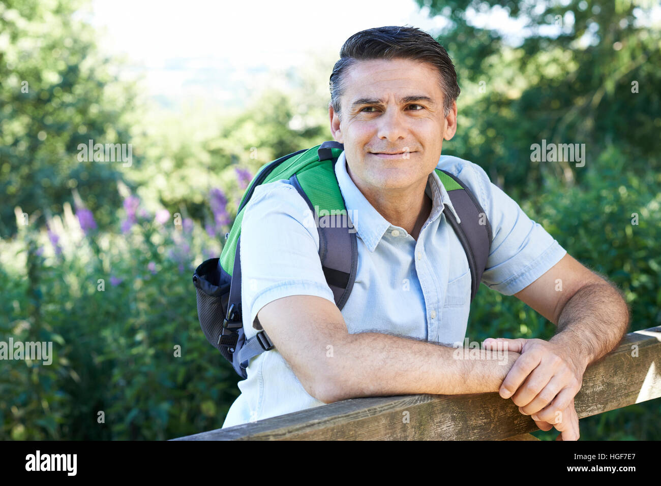 Mature Man Hiking In Countryside Stock Photo