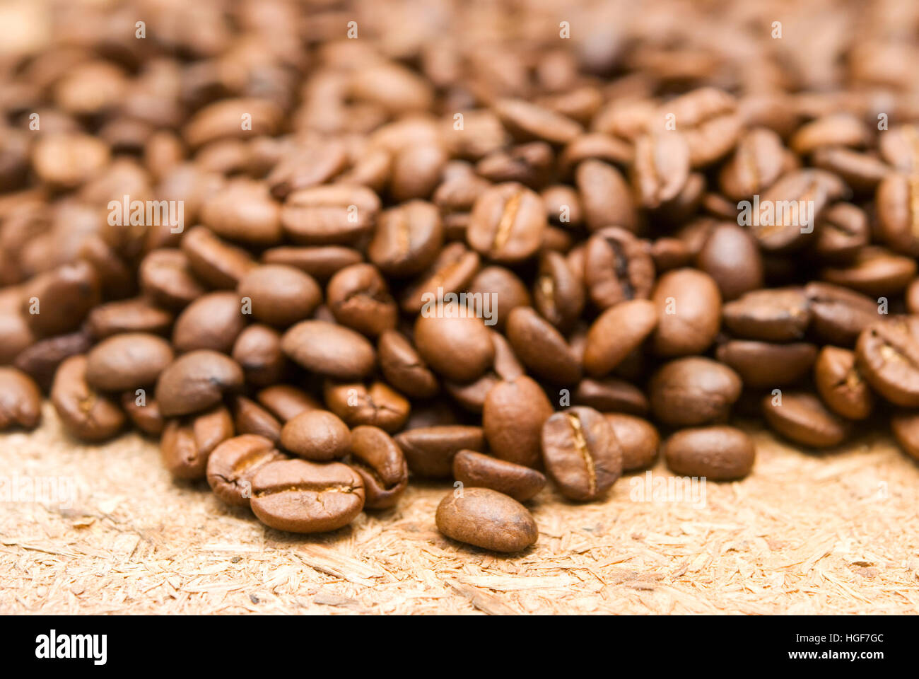 roasted coffee beans close-up on old background Stock Photo - Alamy