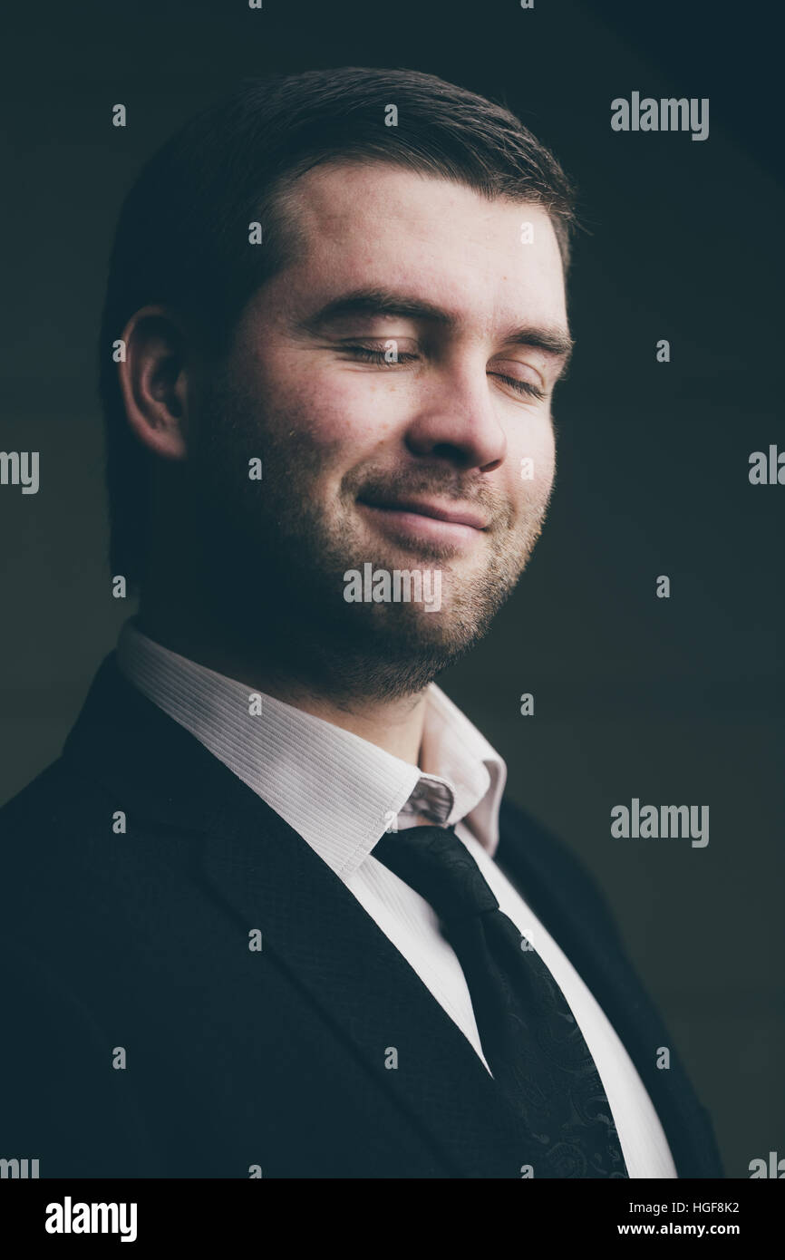 successful businessman on a dark background Stock Photo