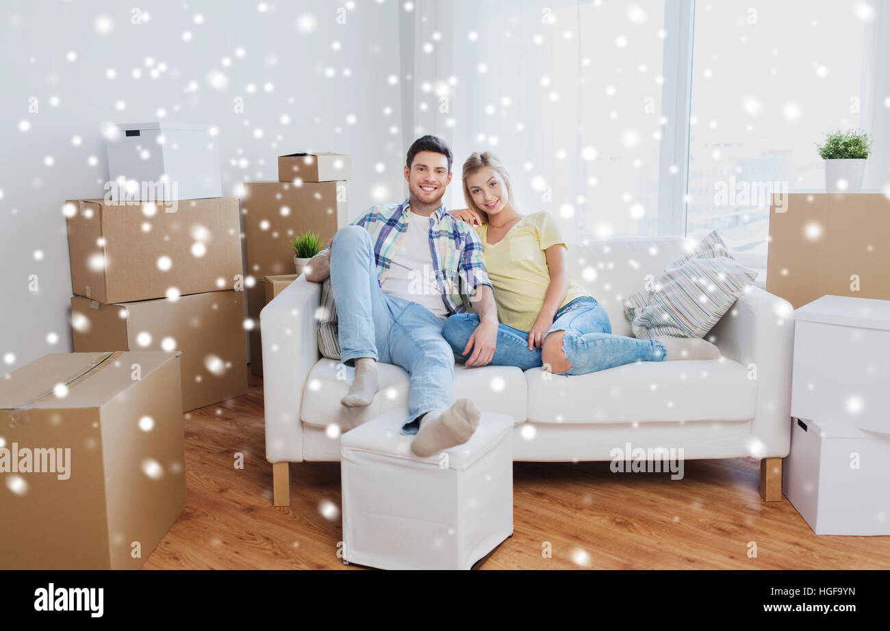 happy couple with big cardboard boxes at new home Stock Photo - Alamy