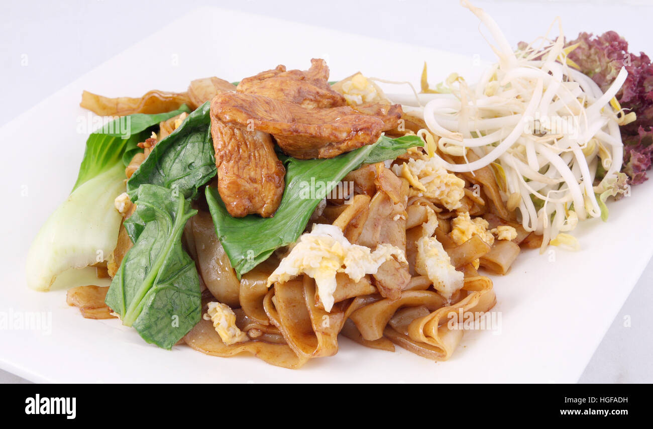 Stir fried flat rice noodle chicken Thai foods Stock Photo