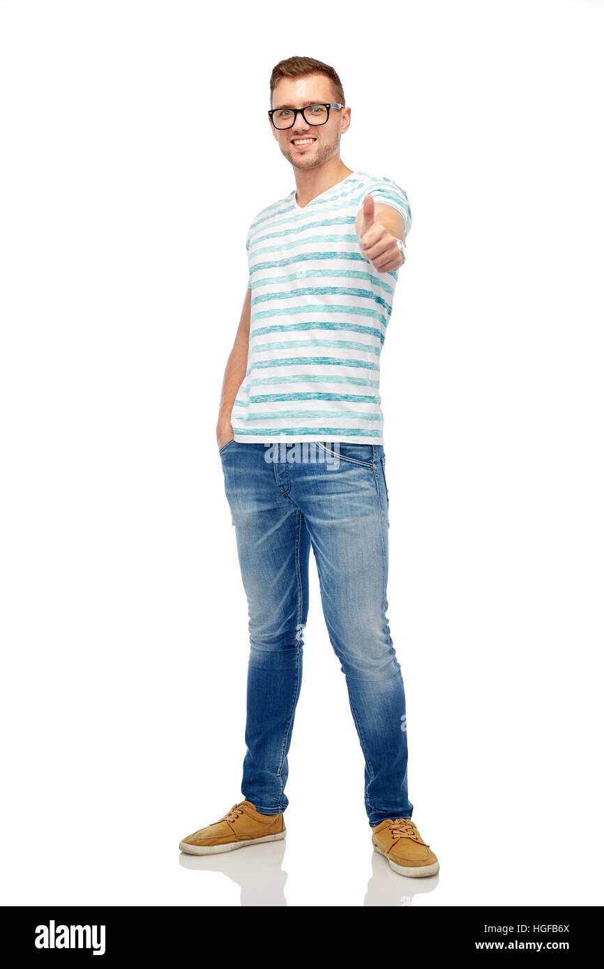 young smiling man in eyeglasses showing thumbs up Stock Photo - Alamy
