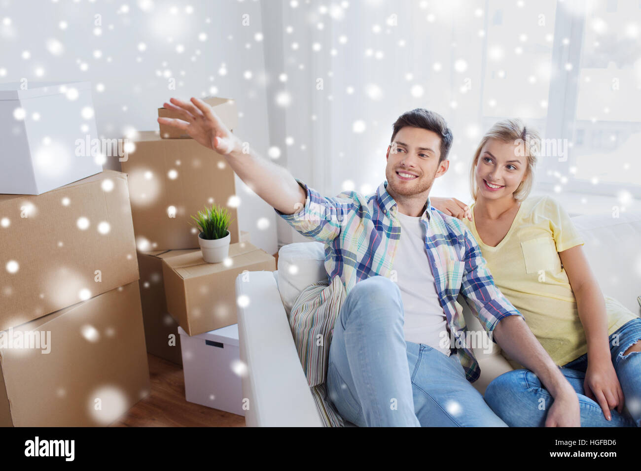 couple with boxes moving to new home and dreaming Stock Photo - Alamy