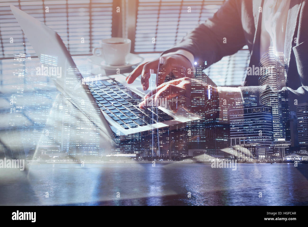 double exposure of business man working online on laptop, close up of hands, checking email or internet banking concept Stock Photo