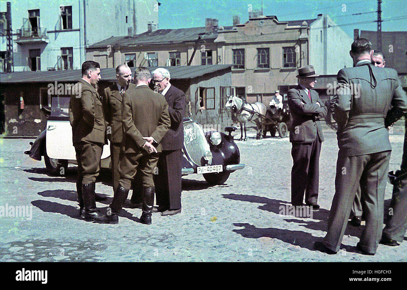 Ghetto Lodz, Litzmannstadt, Mordechai Chaim Rumkowski, head of the Council of Elders meets with German officials on a street of the ghetto, Poland 1940, World War II, Stock Photo