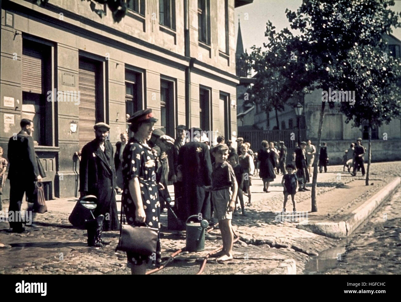 Ghetto Lodz, Litzmannstadt, A doctor near a water tap in a ghetto street, Poland1942, World War II, Stock Photo