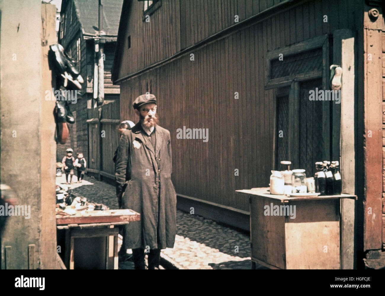 Ghetto Lodz, Litzmannstadt, A man selling goods in a ghetto street, Poland 1942, World War II, Stock Photo
