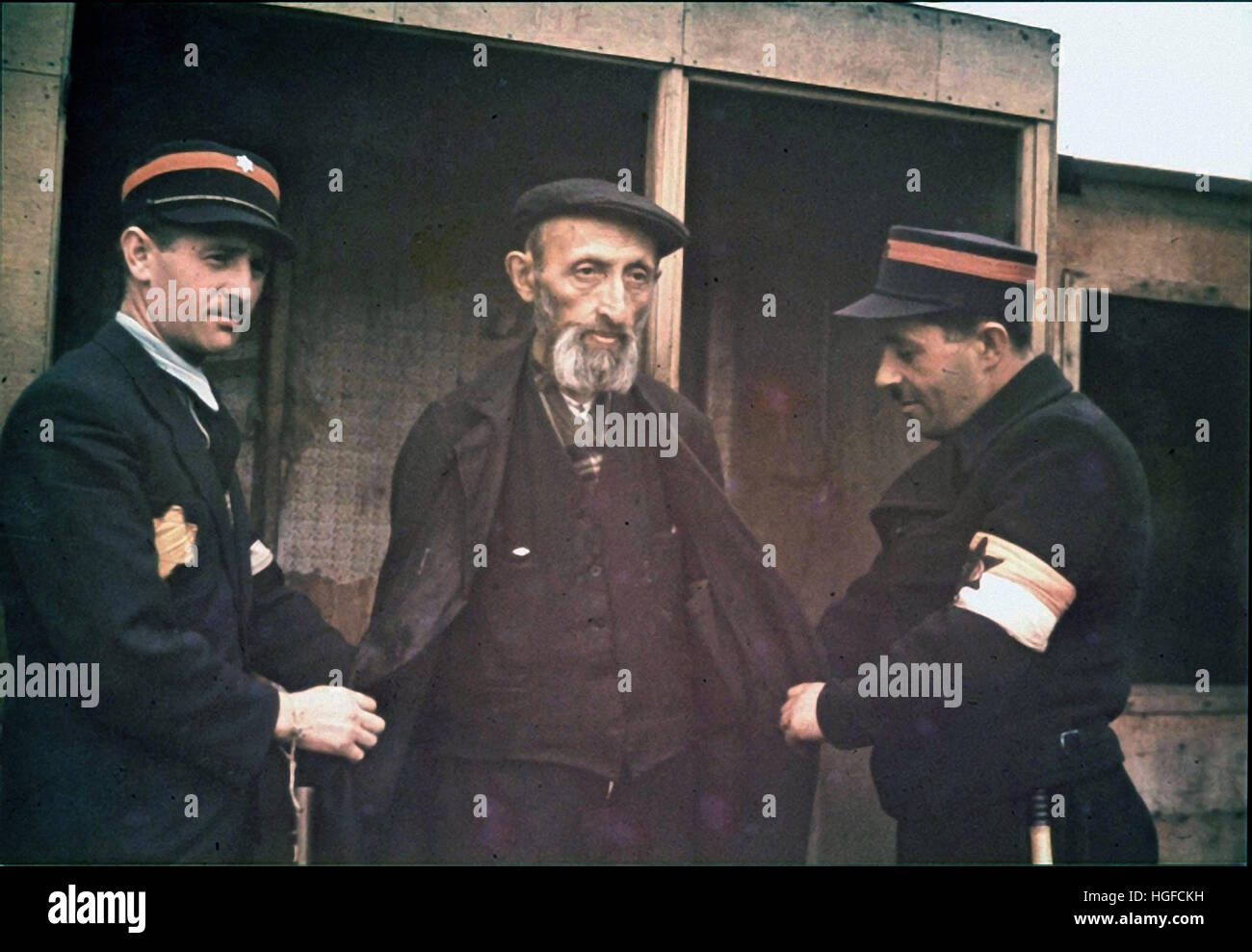 Ghetto Lodz, Litzmannstadt, Jewish policemen arresting an elderly man, Poland 1940, World War II, Stock Photo