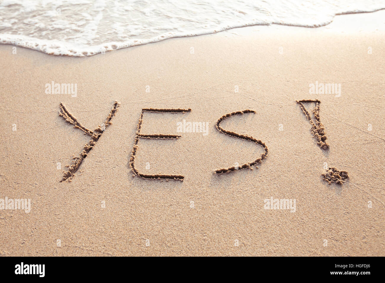 YES concept, positive changes in the life, word written on sand beach Stock Photo