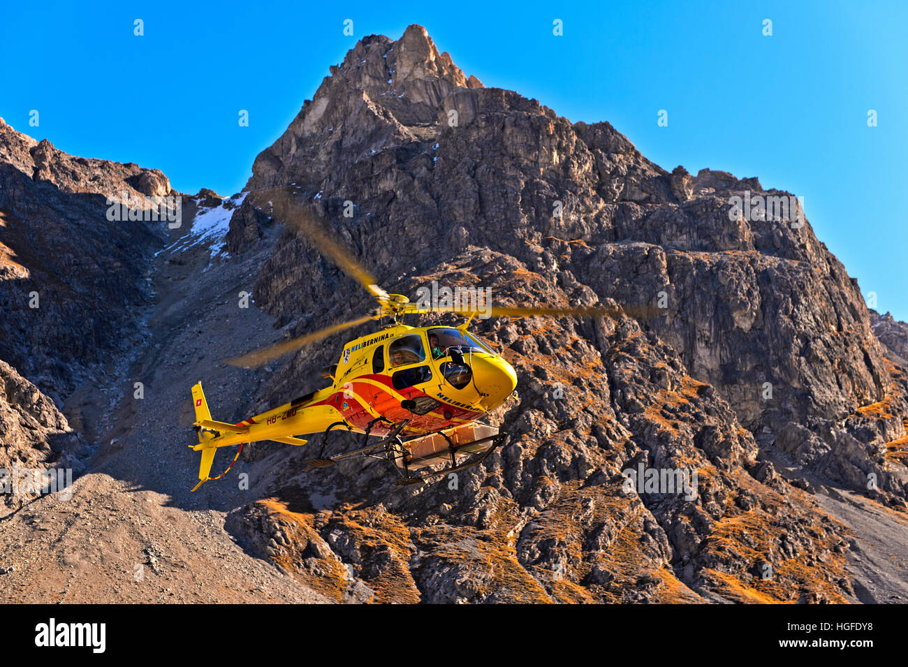 Helicopter Eurocopter AS350 Ecureuil of Heli Bernina AG operating in the Val Lischana, Engadin Alps, Graubunden, Grisons, Switzerland Stock Photo