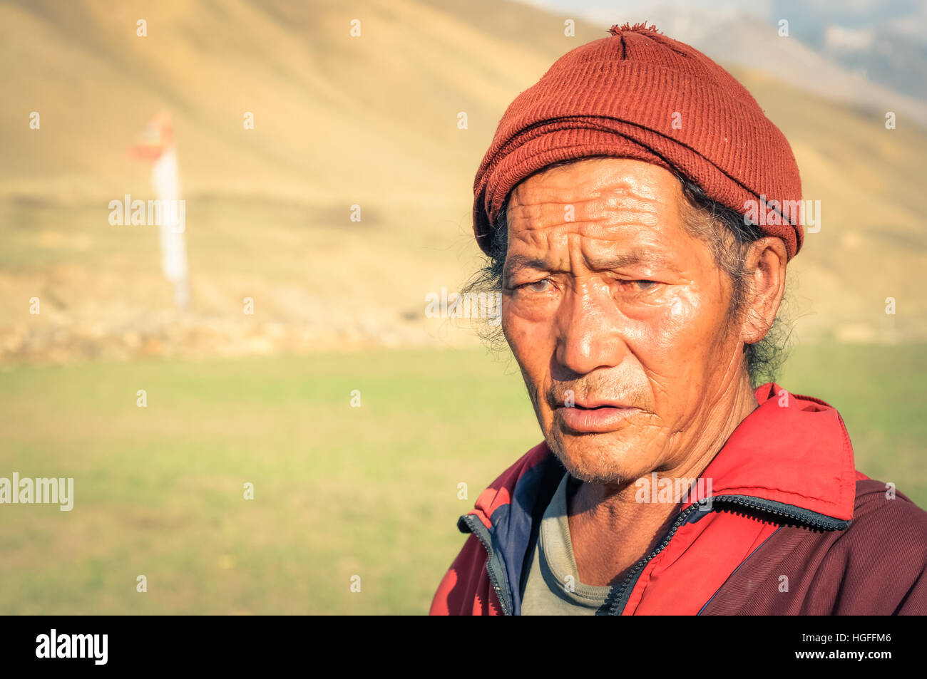 Dolpo, Nepal circa June 2012 Native man in red jacket and with red