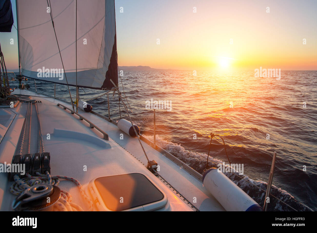 Sail yachts in the Sea. Luxury boat during sunset Stock Photo - Alamy
